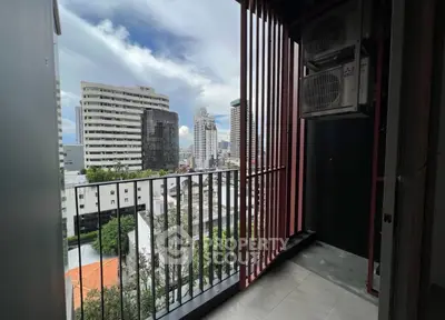 Modern balcony with city view in high-rise apartment