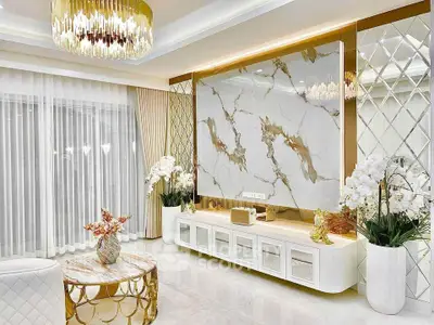 Luxurious living room with elegant marble accents and chic gold decor