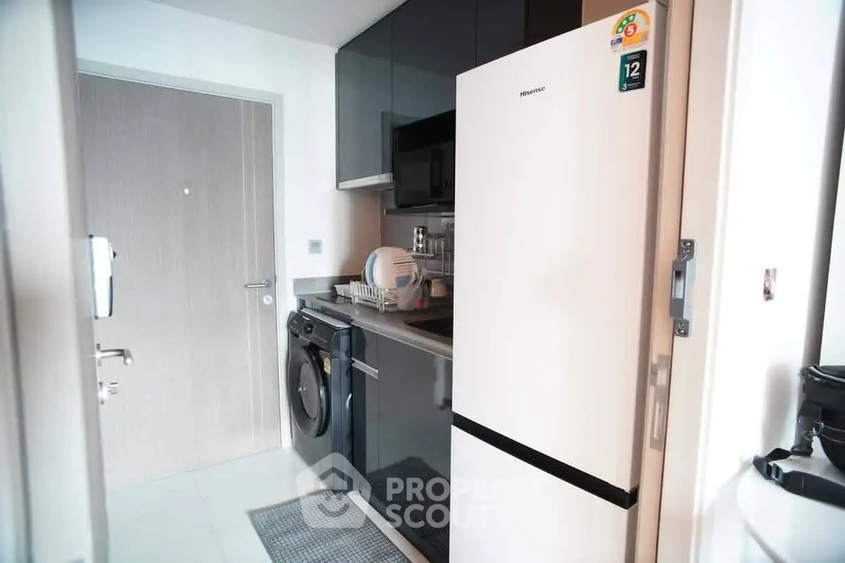 Modern kitchen with sleek appliances and stylish cabinetry