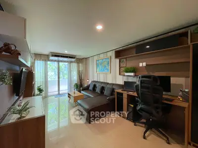 Modern living room with sleek furniture and large window offering lush green views.