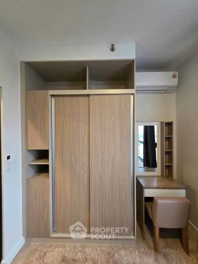 Modern bedroom with built-in wardrobe and stylish dressing table