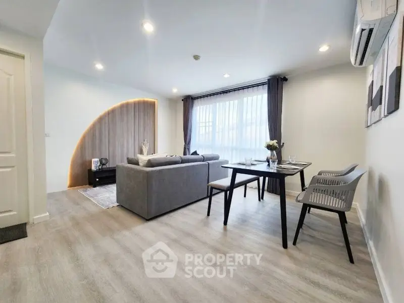 Modern living room with stylish decor and ample natural light