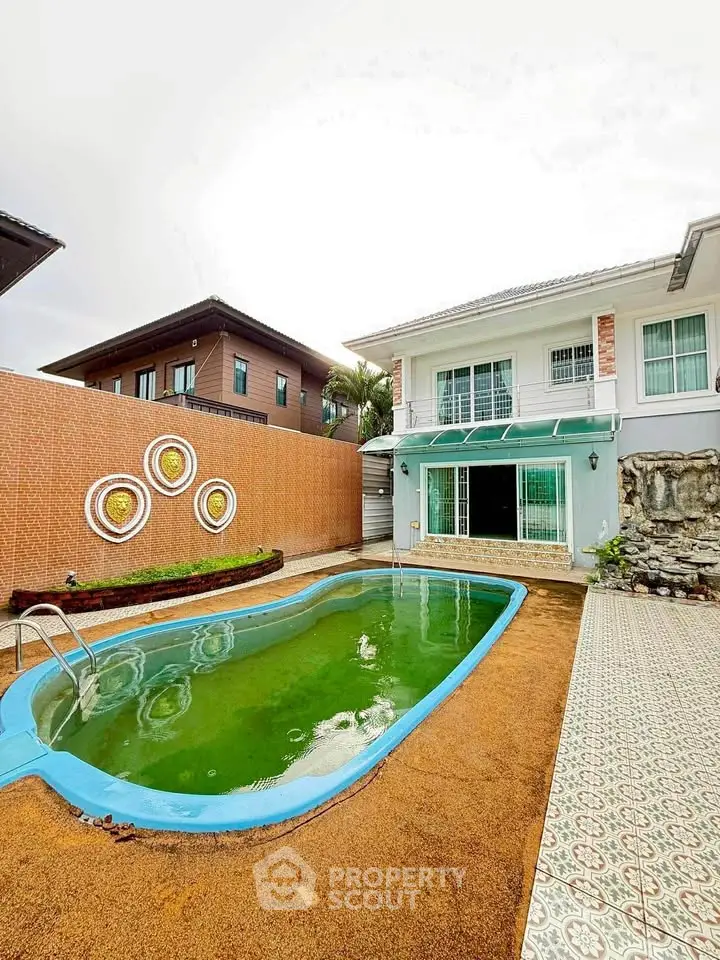 Charming two-story house with private pool and spacious patio, perfect for family gatherings and relaxation.