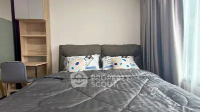Modern bedroom with cozy bed and stylish decor, featuring a study desk and large window with curtains.