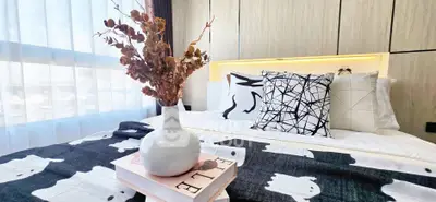 Modern bedroom with stylish decor and natural light