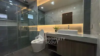 Luxurious modern bathroom with sleek design and ambient lighting