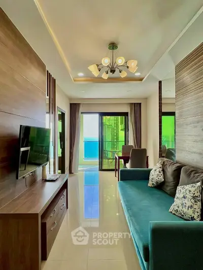 Modern living room with elegant decor and balcony view, featuring a stylish sofa and wall-mounted TV.