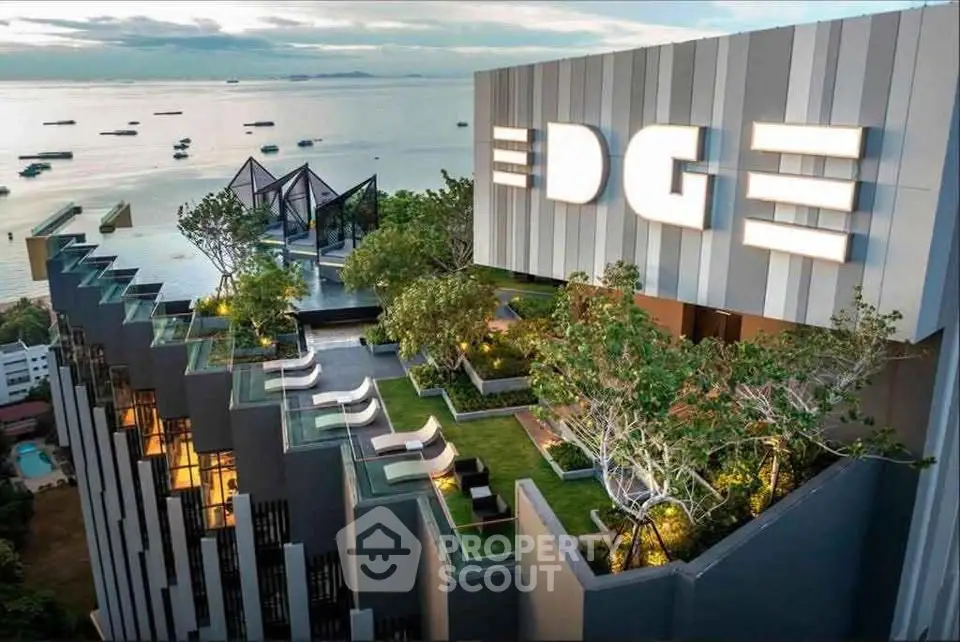 Luxurious rooftop garden with stunning ocean view at modern high-rise building.