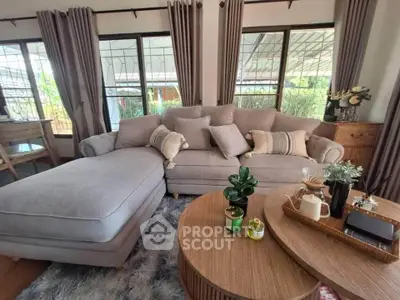 Chic living room with plush sofa and stylish decor, perfect for modern comfort.