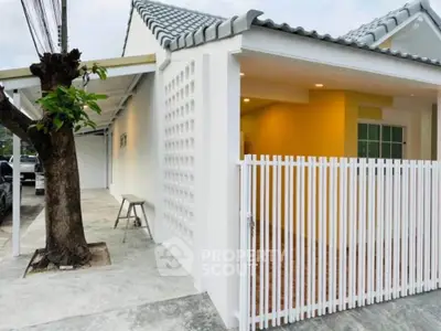 Charming modern house exterior with white fence and tiled roof