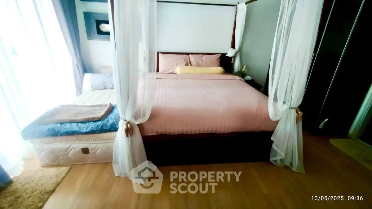 Luxurious bedroom with elegant canopy bed and soft lighting, perfect for relaxation and comfort.