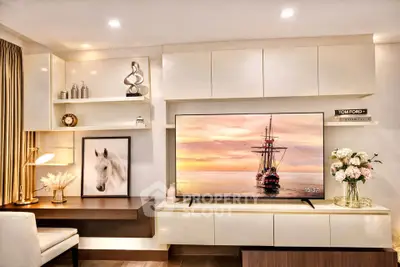 Modern living room with elegant decor, large TV, and stylish shelving.
