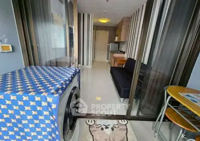 Modern apartment interior with washing machine and cozy living area
