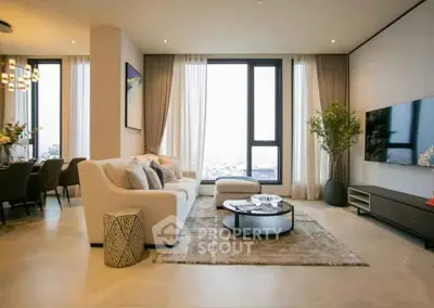 Luxurious modern living room with large windows and elegant decor
