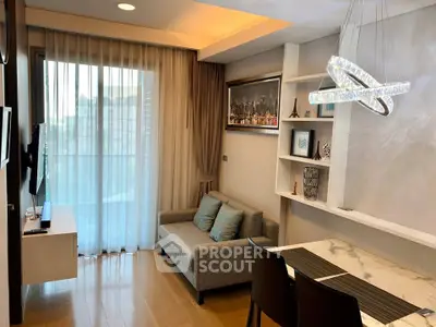 Modern living room with elegant decor and large window in a stylish apartment.