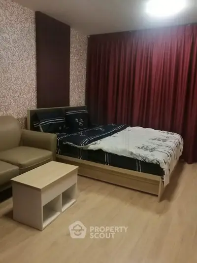 Cozy bedroom with stylish decor and comfortable seating area