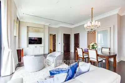 Luxurious living room with elegant decor and chandelier in modern apartment