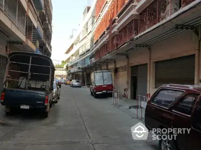 Charming urban street view with parked vehicles and classic architecture