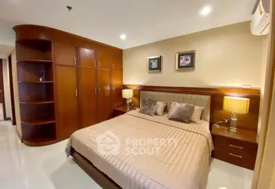Luxurious bedroom with elegant wooden furnishings and ambient lighting