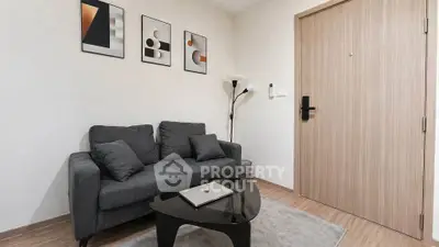 Modern living room with stylish decor and cozy sofa, perfect for relaxation.