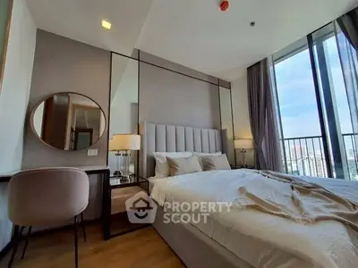 Luxurious bedroom with modern decor and city view balcony