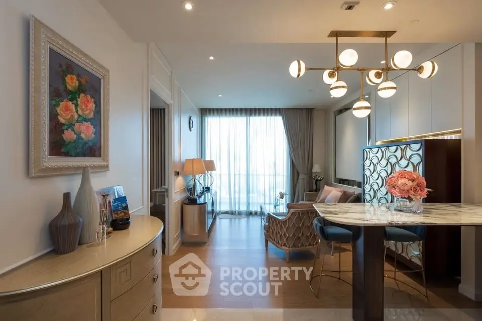 Luxurious living room with elegant decor and stunning lighting, featuring a modern open layout and beautiful artwork.