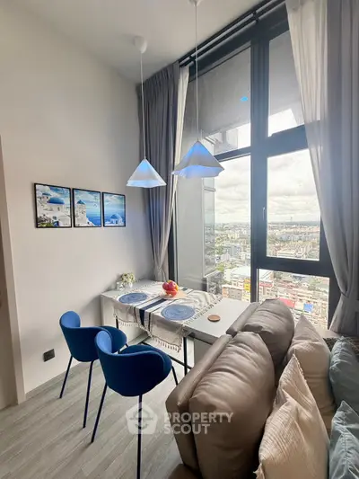 Modern high-rise apartment with stunning city view and stylish dining area