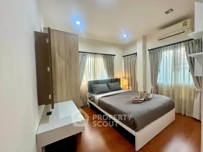 Modern bedroom with stylish decor and natural light