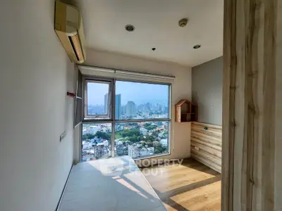 Bright bedroom with stunning city view and wooden accents