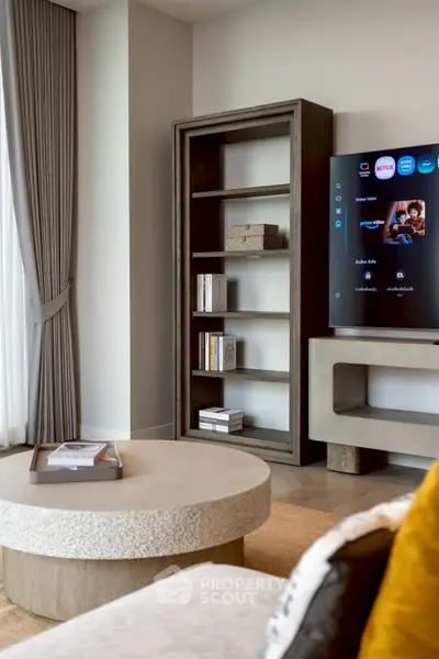 Modern living room with stylish furniture and smart TV setup