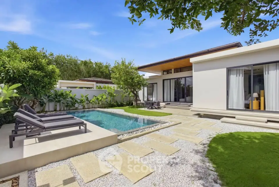 Luxurious modern villa with private pool and lush garden, perfect for serene living.