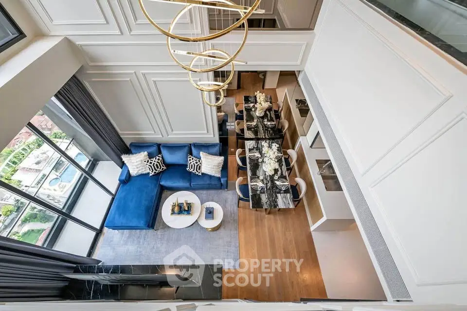 Luxurious modern living room with high ceiling and elegant decor