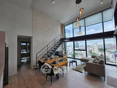 Stunning modern living room with high ceilings and panoramic city views