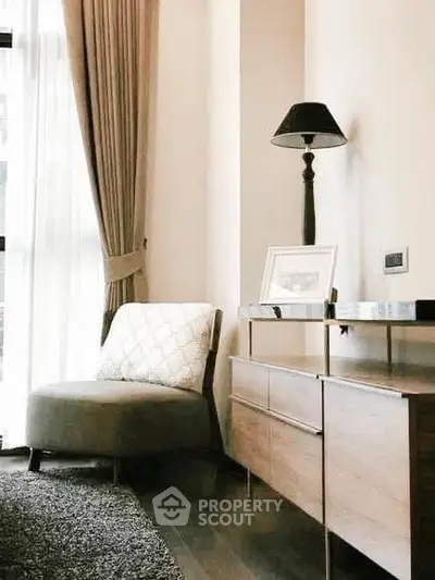 Elegant living room corner with stylish chair and lamp, perfect for relaxation.