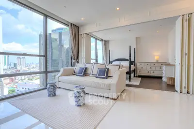 Luxurious high-rise apartment with stunning city views and elegant interior design.
