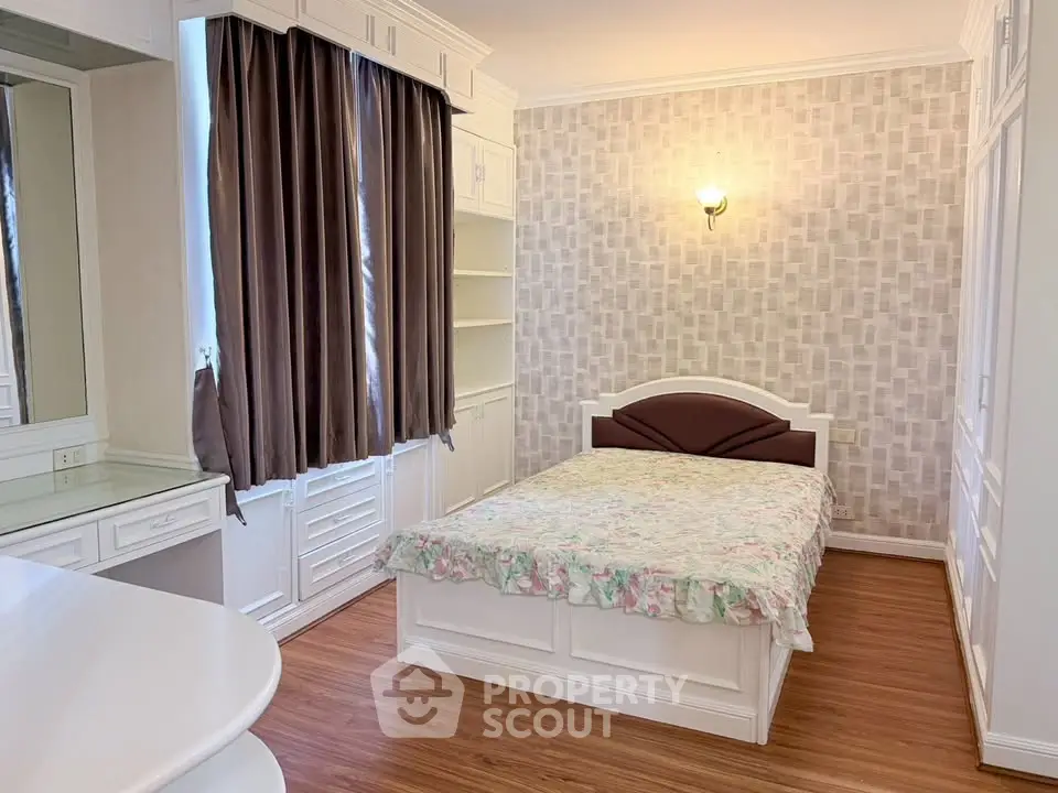 Charming bedroom with elegant decor and ample natural light