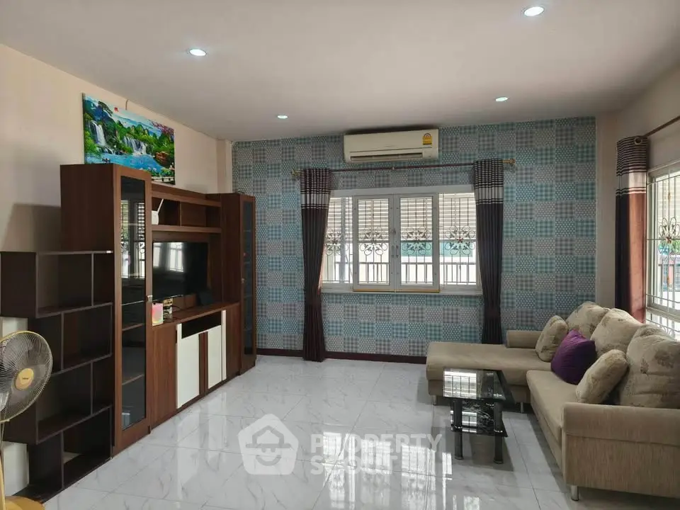 Spacious living room with modern decor and natural light