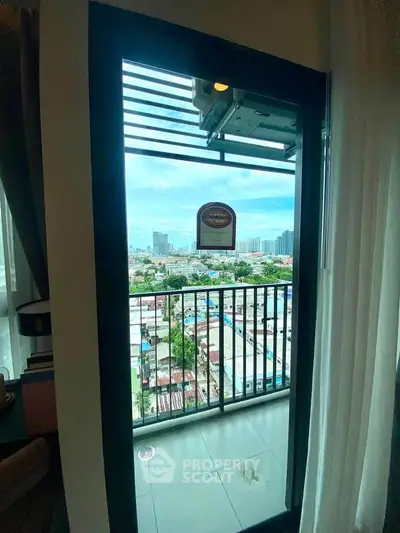Charming balcony view with cityscape backdrop, perfect for urban living enthusiasts.