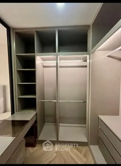 Spacious walk-in closet with modern shelving and ample storage space.
