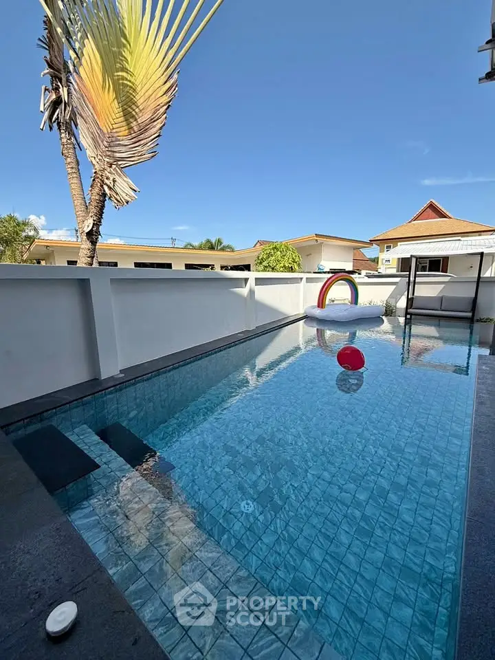 Luxurious private pool with modern design and clear blue water, perfect for relaxation and entertainment.