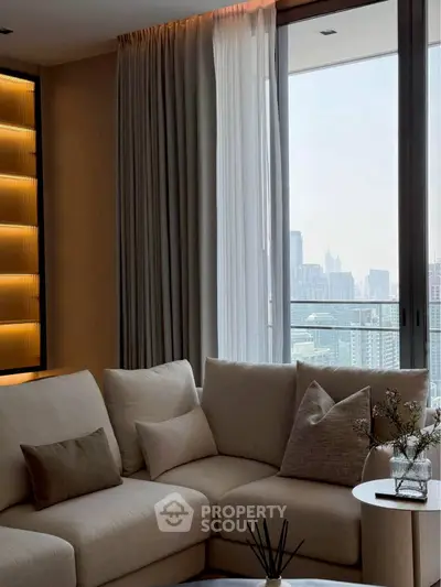 Luxurious living room with city view, elegant decor, and cozy seating area.