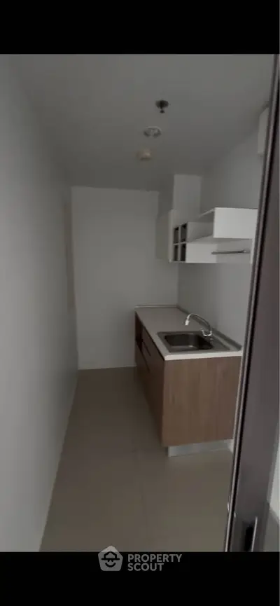Compact modern kitchen with sleek cabinetry and minimalist design