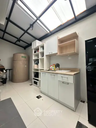 Modern kitchen with sleek cabinetry and ample storage space