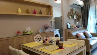 Charming living room with dining area, modern decor, and natural light, perfect for cozy gatherings.