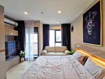 Modern bedroom with large windows, stylish decor, and city view, perfect for urban living.