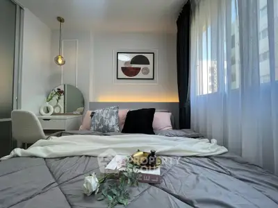 Cozy bedroom with modern decor and natural light, featuring a stylish bed and elegant furnishings.