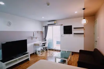 Modern living room with stylish decor and balcony access, featuring a sleek TV setup and cozy seating area.