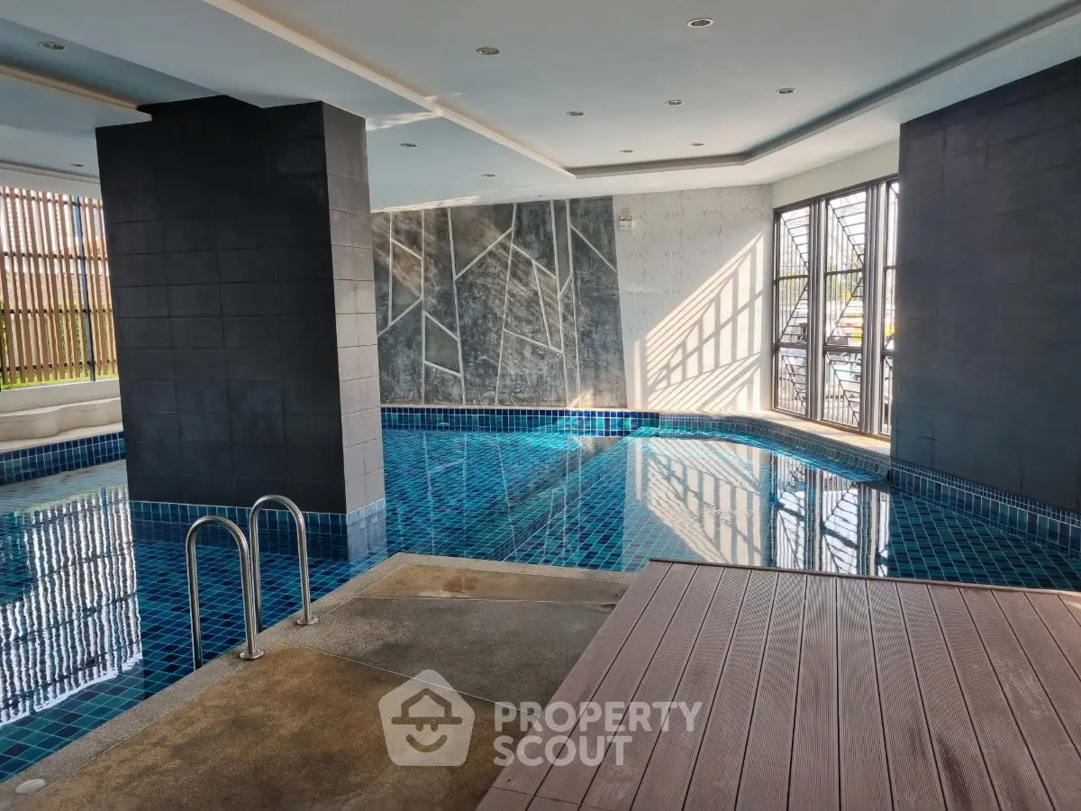 Luxurious indoor pool with modern design and natural light