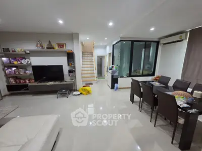 Spacious modern living room with dining area and sleek decor