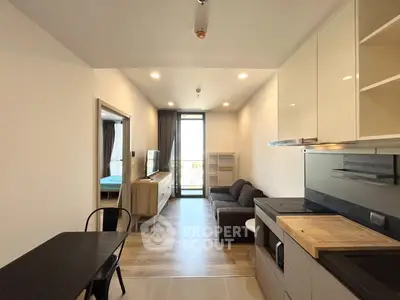 Modern open-plan living room with kitchen in a stylish apartment